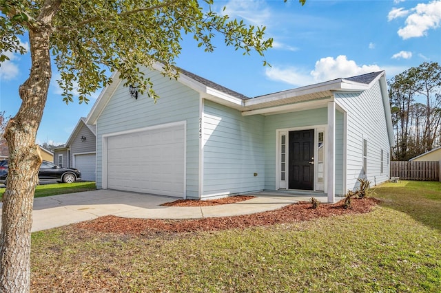 single story home featuring a front yard, concrete driveway, and an attached garage