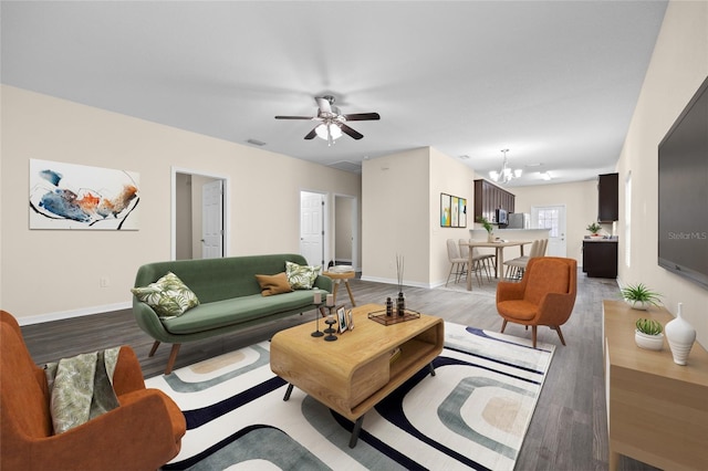 living area with light wood-type flooring, baseboards, and visible vents