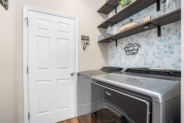 laundry room with laundry area, light wood-style flooring, and washer and dryer