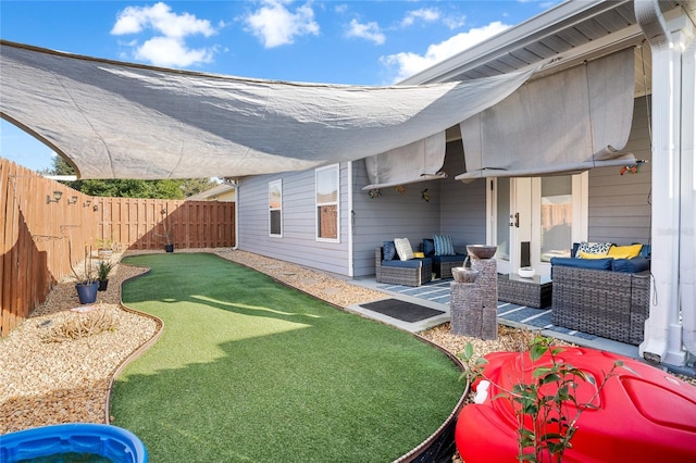 view of yard with a fenced backyard and an outdoor hangout area