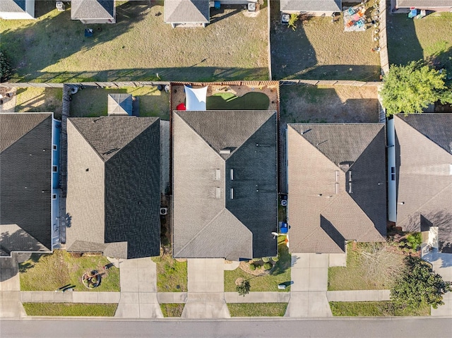 birds eye view of property with a residential view