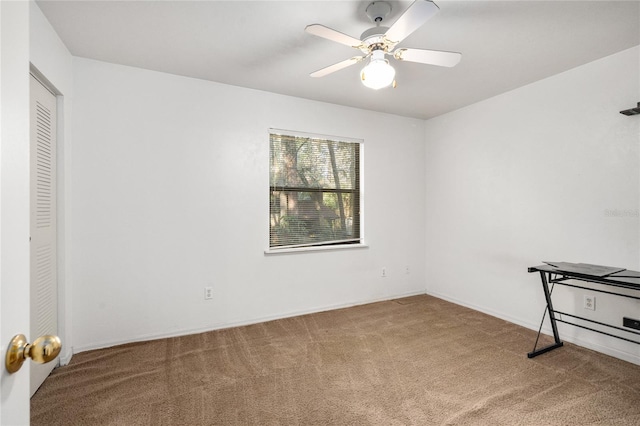 unfurnished bedroom featuring carpet flooring and ceiling fan