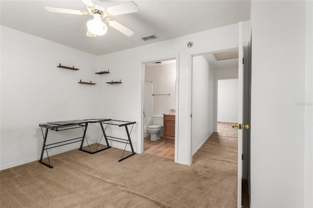 interior space with carpet floors, attic access, visible vents, and baseboards