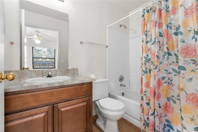 full bathroom featuring toilet, ceiling fan, shower / bath combination with curtain, and vanity