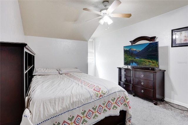 carpeted bedroom with a ceiling fan and baseboards