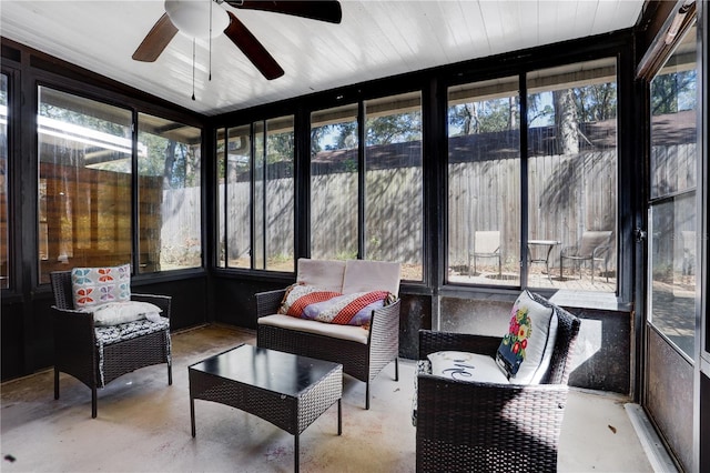 sunroom featuring ceiling fan