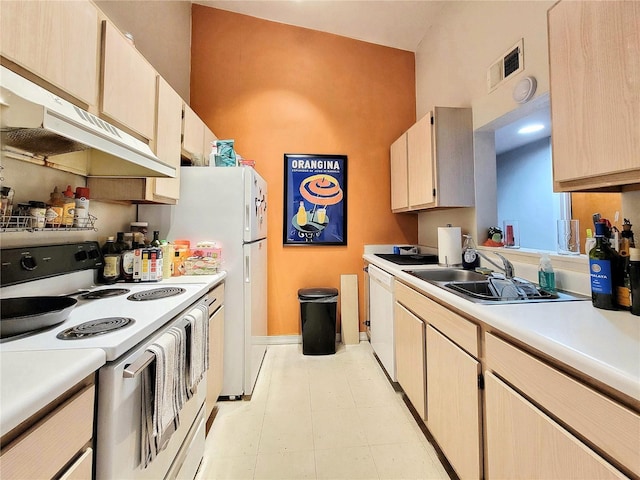 kitchen with visible vents, white appliances, light countertops, and a sink