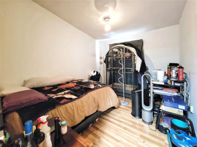 bedroom with wood finished floors