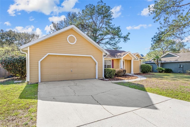 single story home with an attached garage, concrete driveway, and a front yard