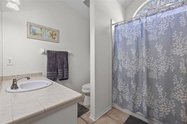 full bath featuring curtained shower, visible vents, toilet, vanity, and tile patterned flooring