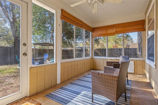 sunroom / solarium with a ceiling fan