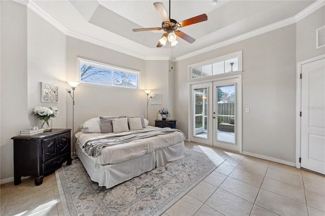 bedroom with a tray ceiling, french doors, ornamental molding, access to outside, and baseboards