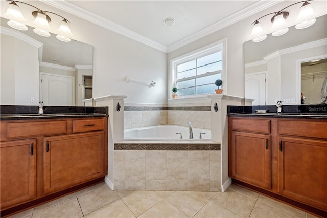 bathroom with a garden tub, tile patterned flooring, two vanities, a sink, and ornamental molding