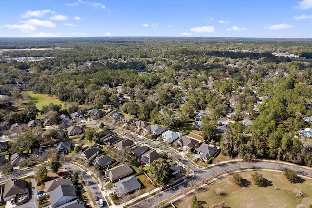 birds eye view of property with a wooded view and a residential view