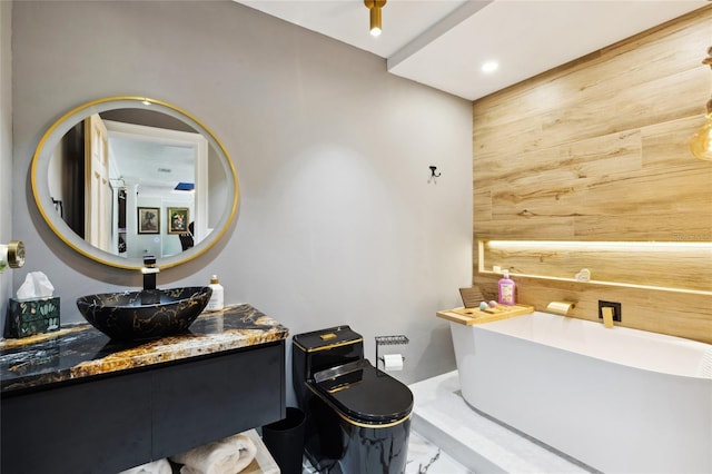 bathroom with marble finish floor, wooden walls, and vanity