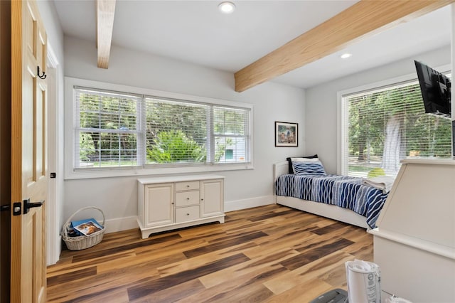 bedroom featuring recessed lighting, baseboards, beamed ceiling, and wood finished floors