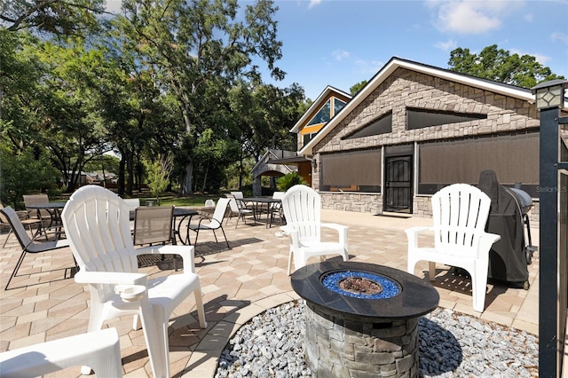 view of patio featuring a fire pit