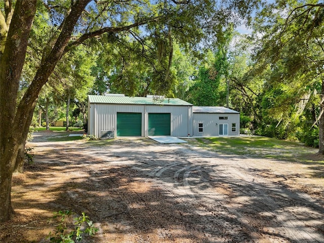 garage featuring driveway