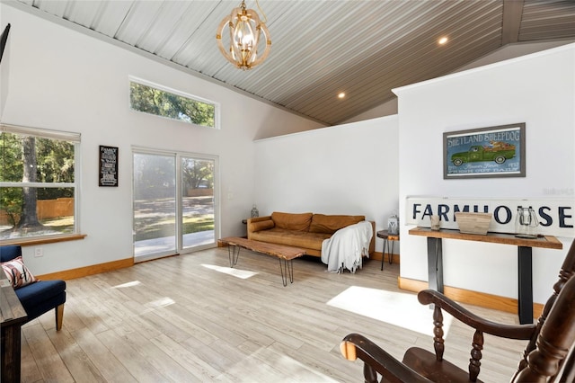 interior space featuring baseboards, wooden ceiling, light wood-type flooring, high vaulted ceiling, and a notable chandelier