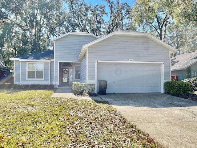 view of front of house featuring a garage, concrete driveway, and a front yard