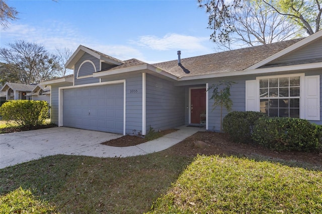 ranch-style home featuring driveway, a front lawn, and an attached garage