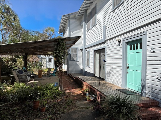 view of property exterior with a pergola and a wooden deck