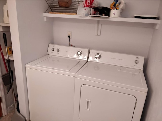 laundry room featuring laundry area and washing machine and clothes dryer