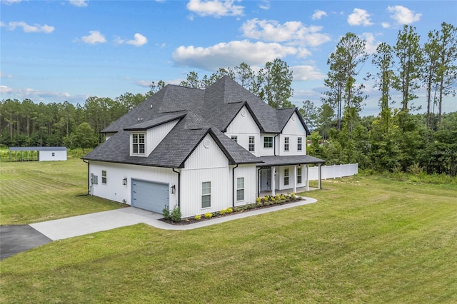 view of front of house with driveway, a shingled roof, and a front lawn