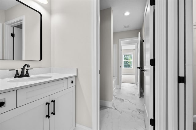 bathroom featuring recessed lighting, visible vents, vanity, baseboards, and marble finish floor