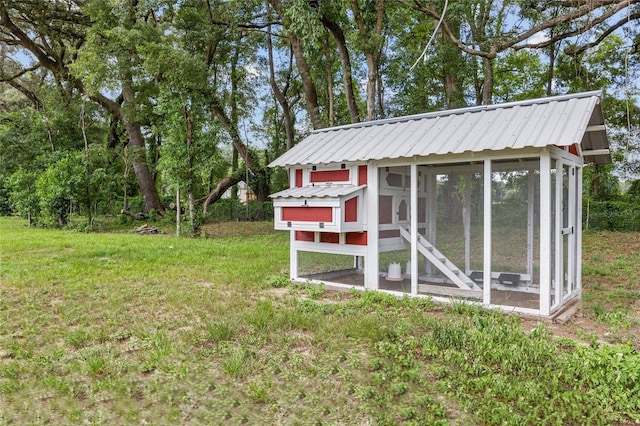 view of poultry coop with a lawn