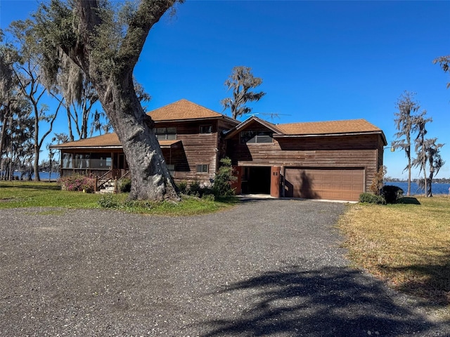 view of front of home with a garage and driveway