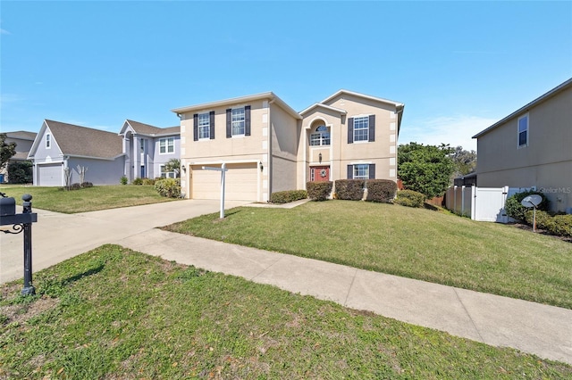 traditional-style home with a garage, driveway, a front lawn, and stucco siding