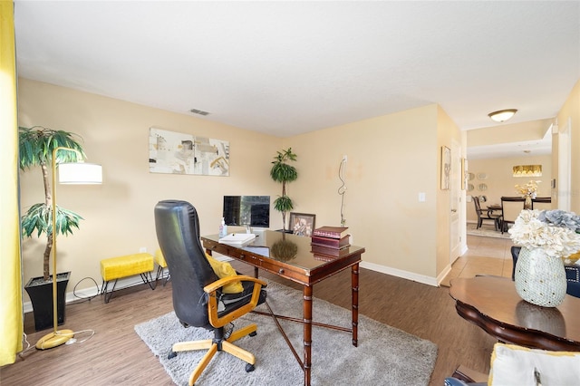 office with baseboards and wood finished floors