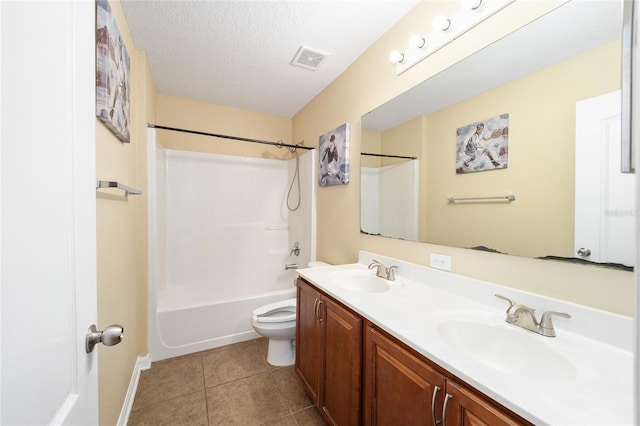 full bath featuring a textured ceiling, tile patterned flooring, a sink, and visible vents