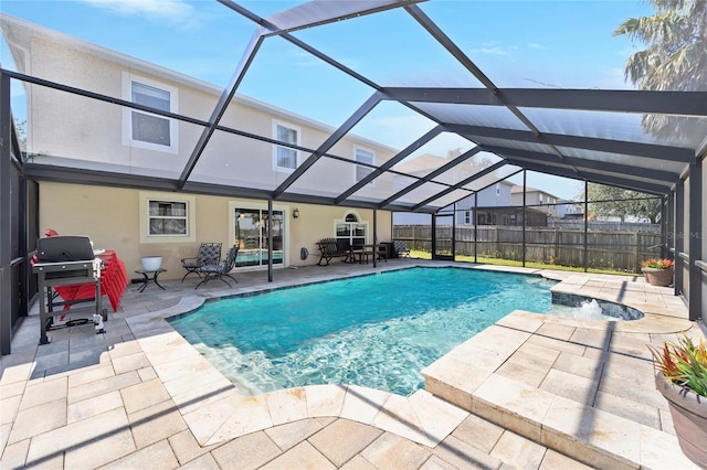 view of pool featuring a patio, grilling area, fence, and a lanai