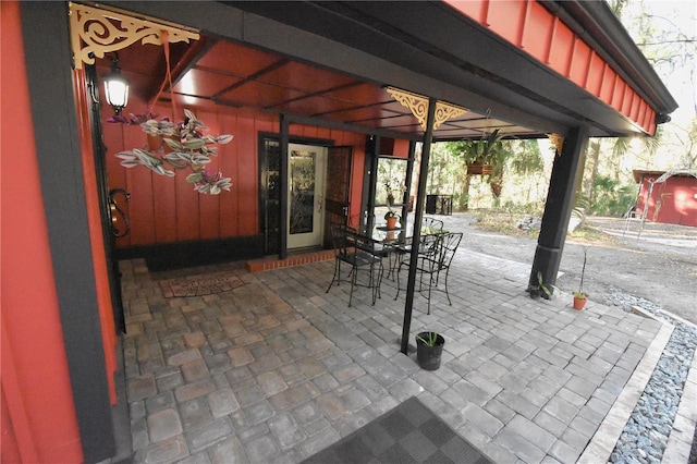 view of patio featuring outdoor dining area