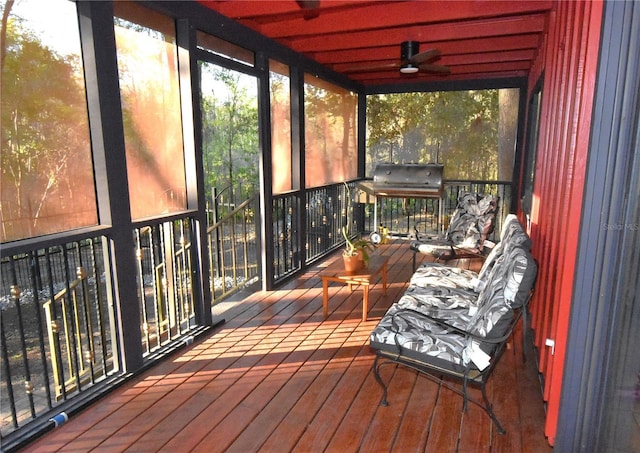 sunroom featuring ceiling fan