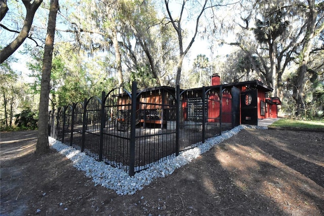 view of gate featuring a fenced front yard