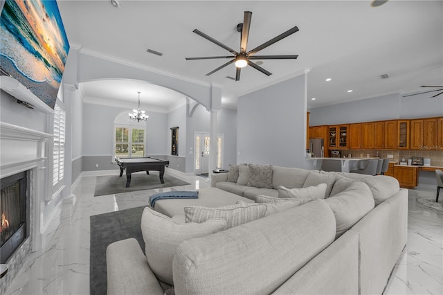 living room with billiards, visible vents, arched walkways, a ceiling fan, and marble finish floor