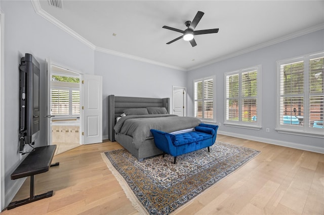 bedroom with ornamental molding, light wood-type flooring, visible vents, and baseboards