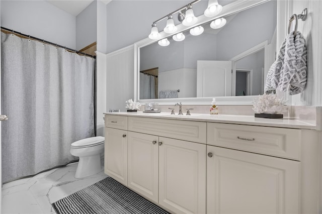 full bathroom with marble finish floor, a shower with shower curtain, vanity, and toilet