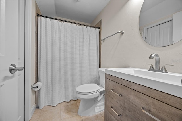 bathroom with toilet, tile patterned flooring, a shower with shower curtain, and vanity