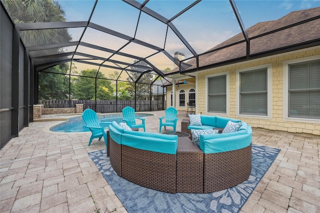 view of patio featuring a fenced in pool, a lanai, fence, and an outdoor hangout area