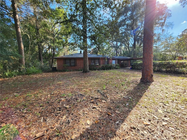 view of front facade featuring brick siding