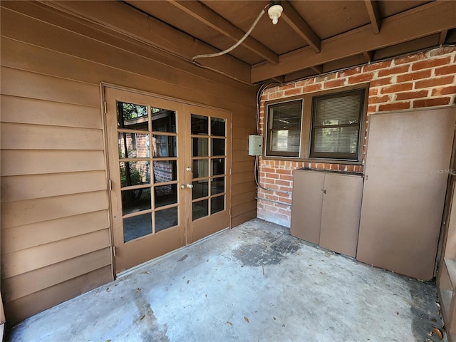 interior space featuring concrete floors and french doors