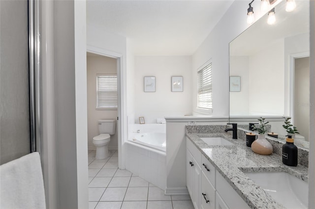 full bathroom with toilet, a garden tub, tile patterned flooring, and a sink