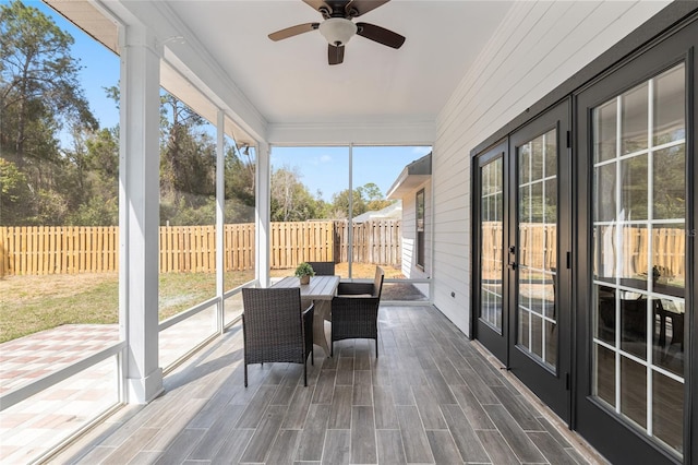 sunroom with a ceiling fan