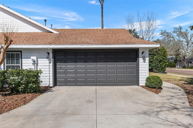 garage with concrete driveway