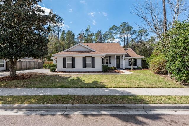 view of front of property with a front yard and fence