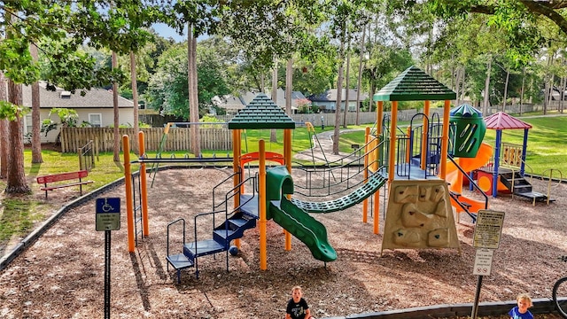 community jungle gym featuring fence